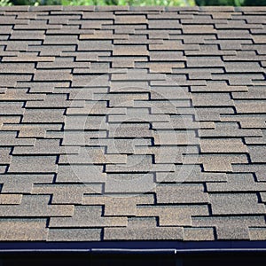 Modern roofing and decoration of chimneys. Flexible bitumen or slate shingles