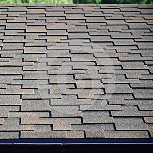 Modern roofing and decoration of chimneys. Flexible bitumen or slate shingles