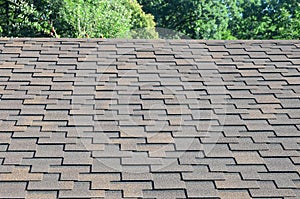 Modern roofing and decoration of chimneys. Flexible bitumen or slate shingles