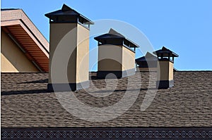 Modern roofing and decoration of chimneys. Flexible bitumen or slate shingles. The absence of corrosion and condensation due to t