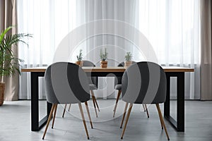 Modern room interior with chairs and table