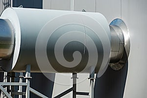 Modern round industrial pipes made of bright metal