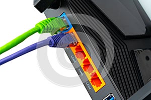 Modern router with cables plugged in close up photo