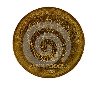 Modern russian coin of golden alloy. Revers seal of Bank of Russia depicting two-headed eagle heraldic signs of Russian Empire.