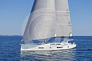 Modern sailing yacht in action photo