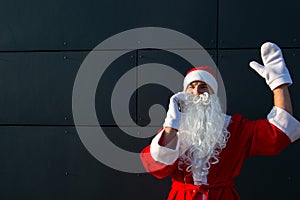 Modern Santa Claus talking on the phone. Ordering the services of an animator for the Christmas and new year. Online greetings via