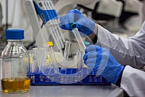 Modern scientist student working with biotechnological laboratory equipment