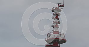 Modern sea radio tower Close-up on the background of the cloudy autumn sky