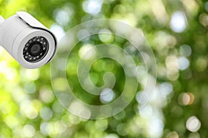 Modern security CCTV camera outdoors, space for text