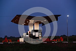 Modern self service gas station at night