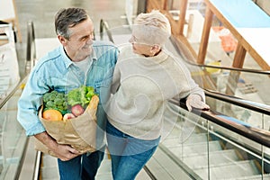 Modern Senior Couple Shopping in Mall