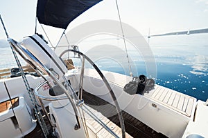 Modern ship control panel with steering wheel