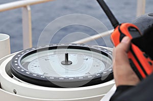 Modern ship's compass and VHF photo