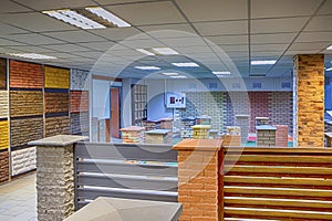 Modern Showroom of Construction Materials Production Company With Equipment and Decorated Walls