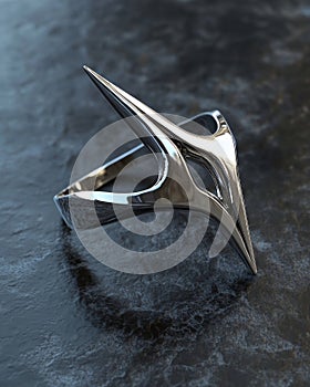 Modern silver ring with abstract design on textured surface