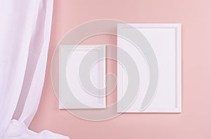 Modern simple gallery with set of blank rectangle photo frames for text, design or pictures with folded silk curtain hanging.
