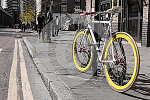 Modern single gear bycicle with yellow tyres