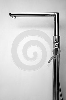 Modern single handle bathtub faucet on light grey background