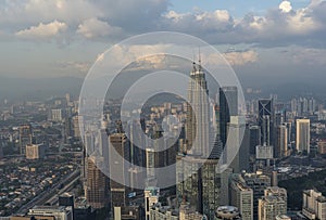 Modern skyline buildings of Kuala Lumpur Malaysia with dark clouds