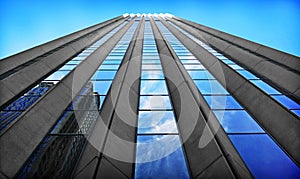 Modern skyscraper in business district with blue sky