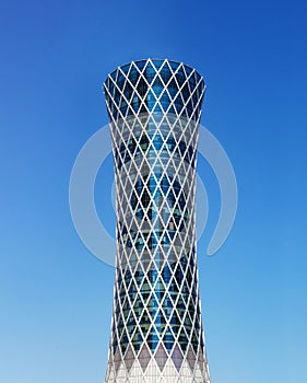 Modern skyscraper Tornado tower in Qatar on blue background