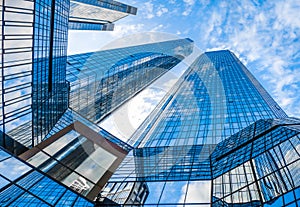 Modern skyscrapers in business district against blue sky