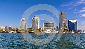 Modern skyscrapers line the Dubai Creek in the UAE