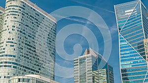 Modern skyscrapers timelapse in famous financial and business district of Paris - La Defense.