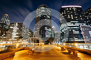 Modern skyscrapers at Tsim Sha Tsui at night, in Kowloon, Hong K