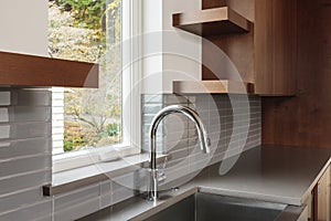 Modern sleek kitchen with brown cabinets