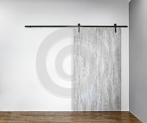 Modern sliding gray door on white wall