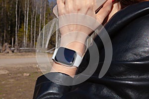 Modern smart watch on a girlâ€™s hand, close-up