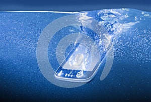 Modern smartphone thrown into water