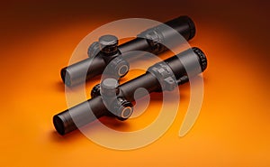 Modern sniper scopes on a colored back. Optical device for long-range aimed shooting
