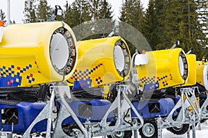 Modern snow cannons in line