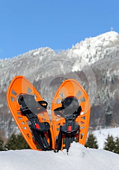 Modern snowshoes in the mountain photo