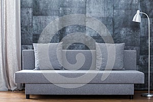 Modern sofa and concrete wallpaper