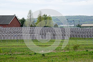 Modern solar panels on beautiful green grass alternative energy concept photo