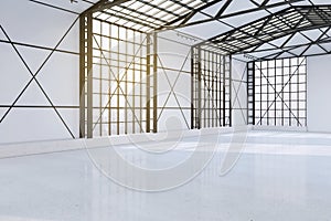 Modern spacious concrete empty hangar interior with city view and window frames. Factory and industrial concept.