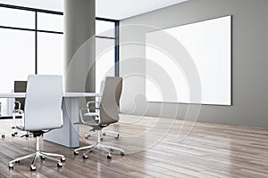 Modern spacious meeting room interior with blank white mock up banner on wall, white chairs, wooden parquet flooring and panoramic