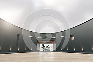 Modern spacious round exhibition hall interior with decorative plants in pots and wooden parquet flooring. White mock up place on