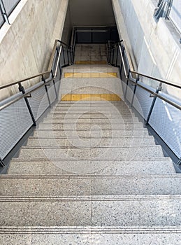 The modern staircase with the braille block tile of the metro sky train