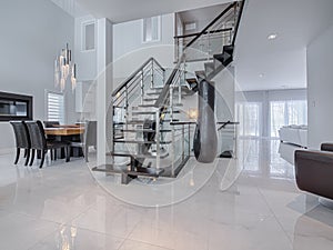 Modern stairs on marble floors in house