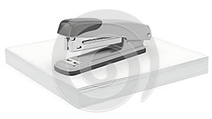 Modern stapler on a stack of paper