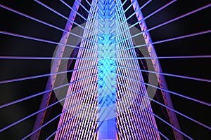 Modern Steel Bridge with multi color lights at night closeup view