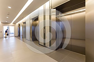 Modern steel elevator cabins in a business lobby or Hotel, Store