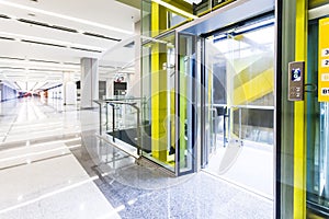 Modern steel elevator doors cabins in a business lobby or Hotel, Store, interior, office,perspective wide angle. Three elevators