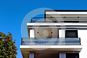 modern steel picket terrace balustrade closeup. white stucco exterior wall elevation.