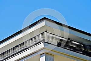 modern steel picket terrace balustrade closeup. white stucco exterior wall elevation.