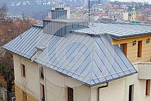Modern Steel-Roof, Chimney and Fume Hoods. Metal Rofing Construction. Rain gutter.